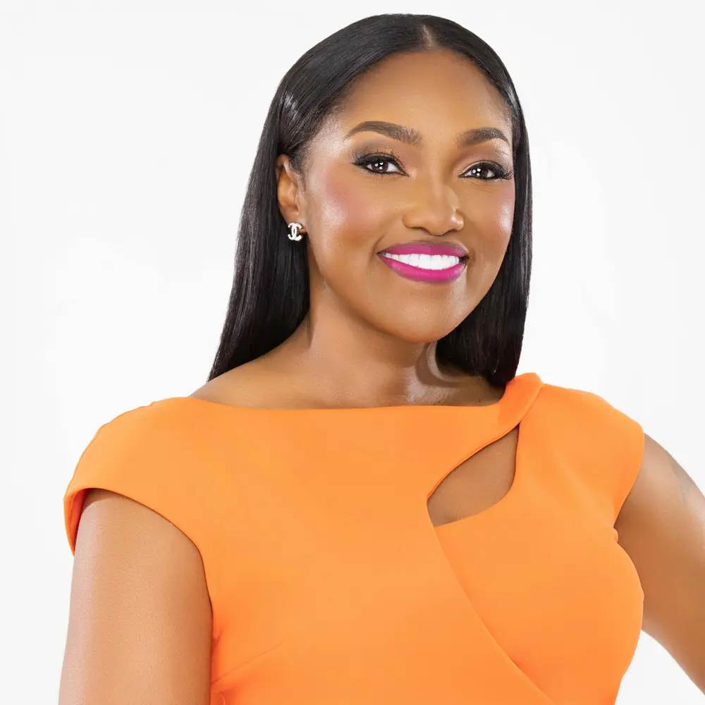 Dr. April Spencer in orange dress