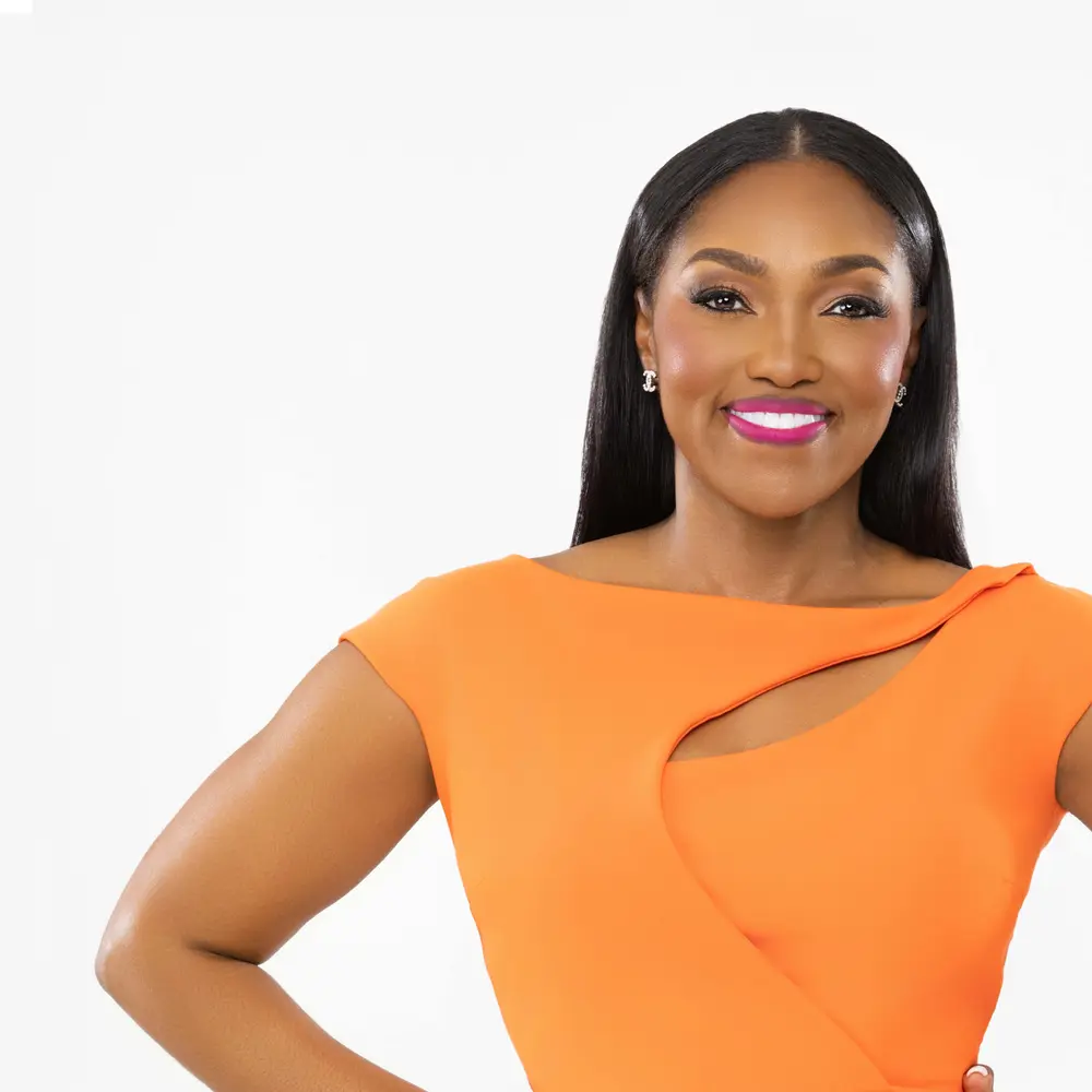 Dr. April Spencer in orange dress, right side of picture frame